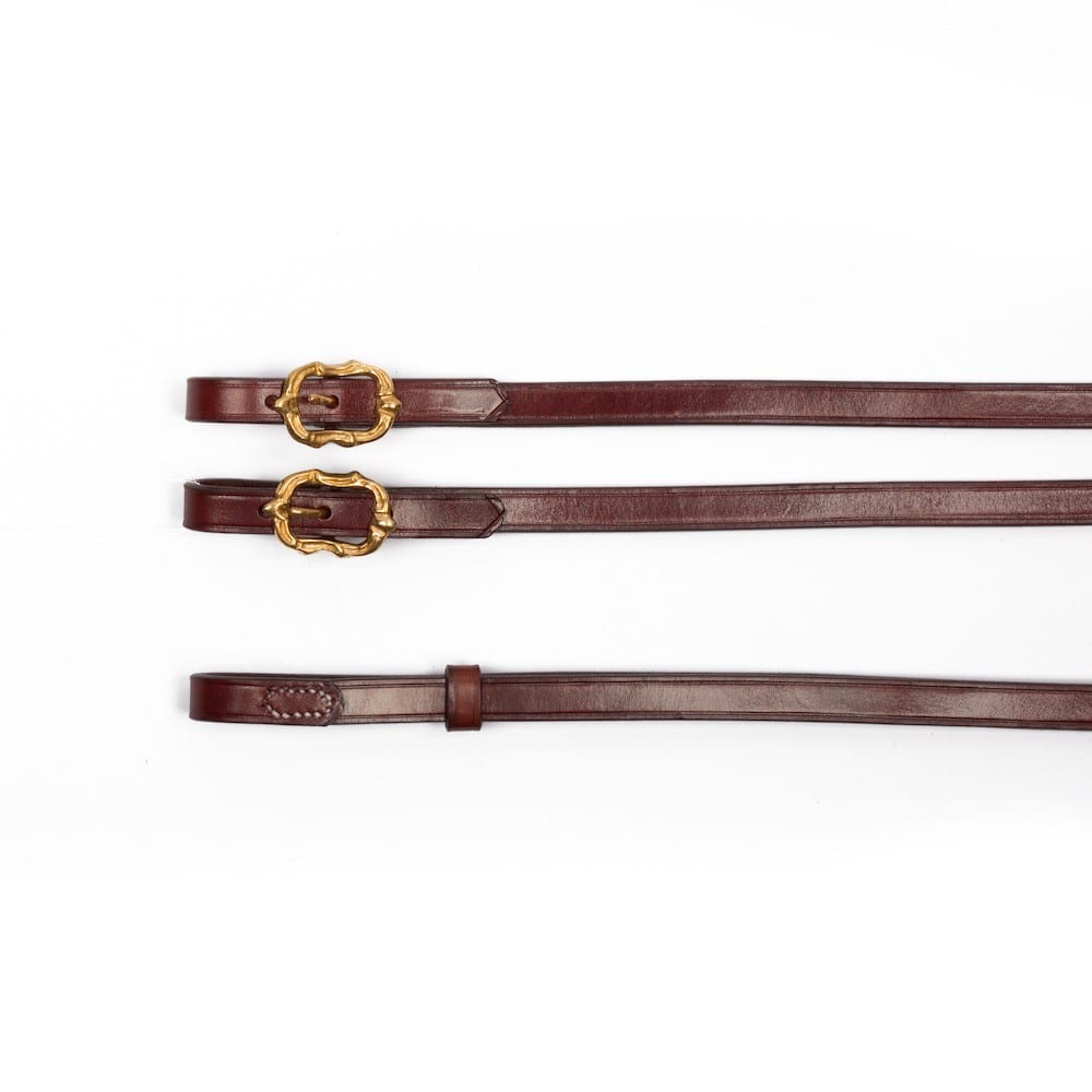 Baroque brown leather reins with golden Cortesia buckles at Picadera