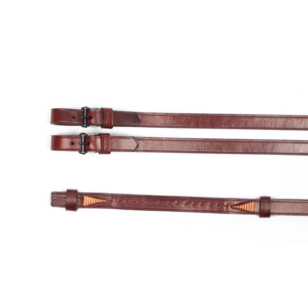 Brown reins with black buckles for Vaquero bridle at Picadera
