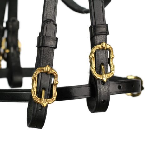Baroque Portuguese style double bridle in black with gold-coloured cortesia buckles.