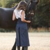 Pants riding skirt in blue stripes from Picadera &amp; Friesian horse