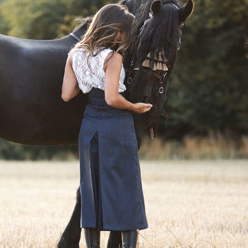 Trousers Riding Skirt in Blue Striped from Picadera with Friesian Horse