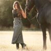riding skirt in black striped from Picadera with Friesian horse